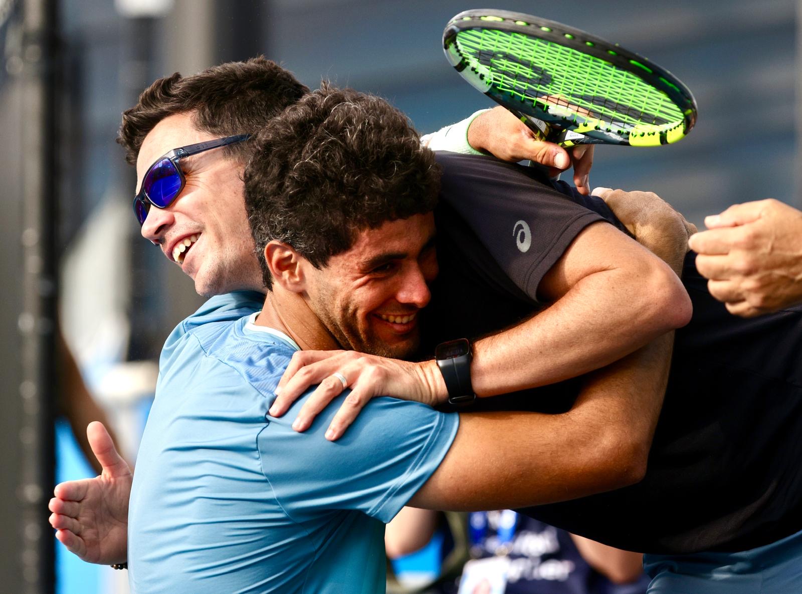Coach and player celebrating together
