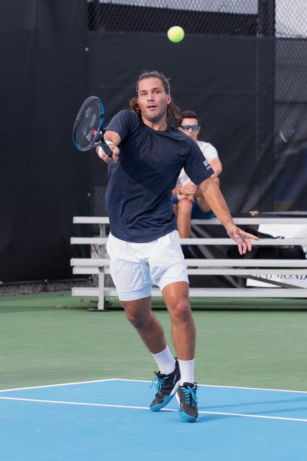 Professional player training with Yannick Dumas in the background